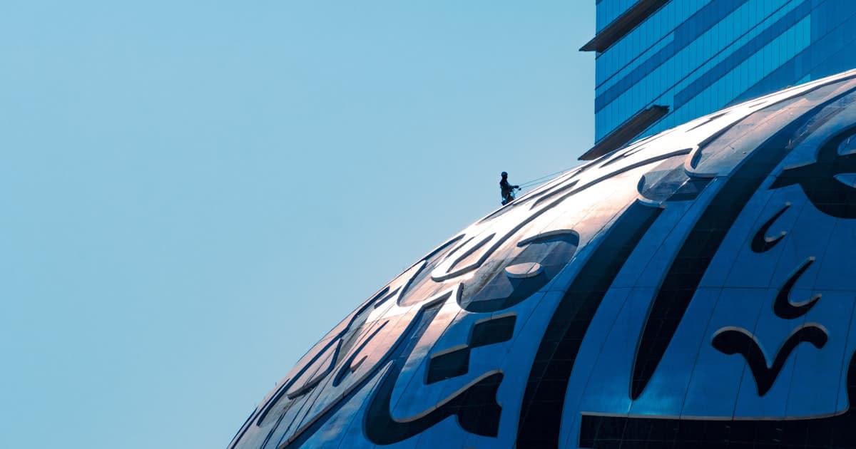 Modern glass building in Dubai with futuristic architecture